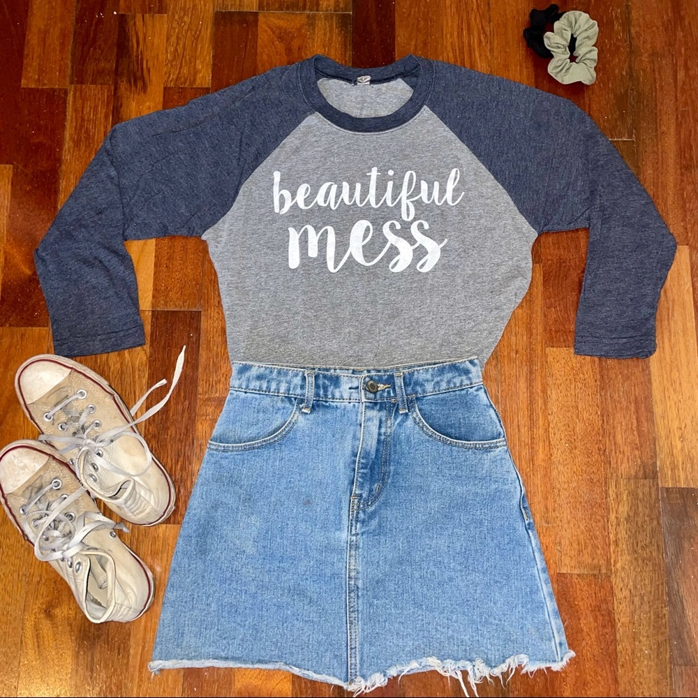 T-shirt w/ calligraphy reading “beautiful mess.”